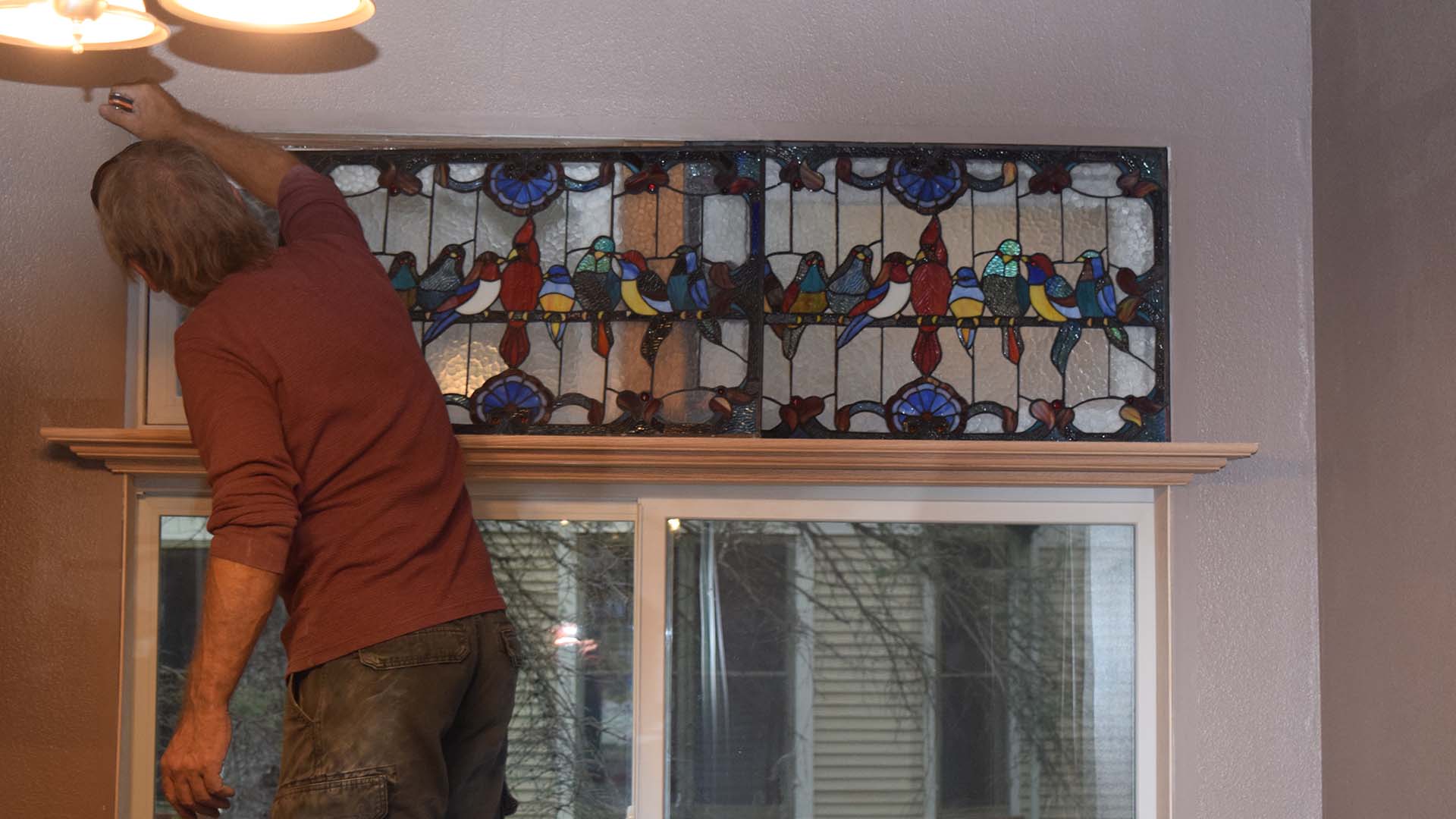 New Cabinets with Granite Tiles and a Black Granite Sink.